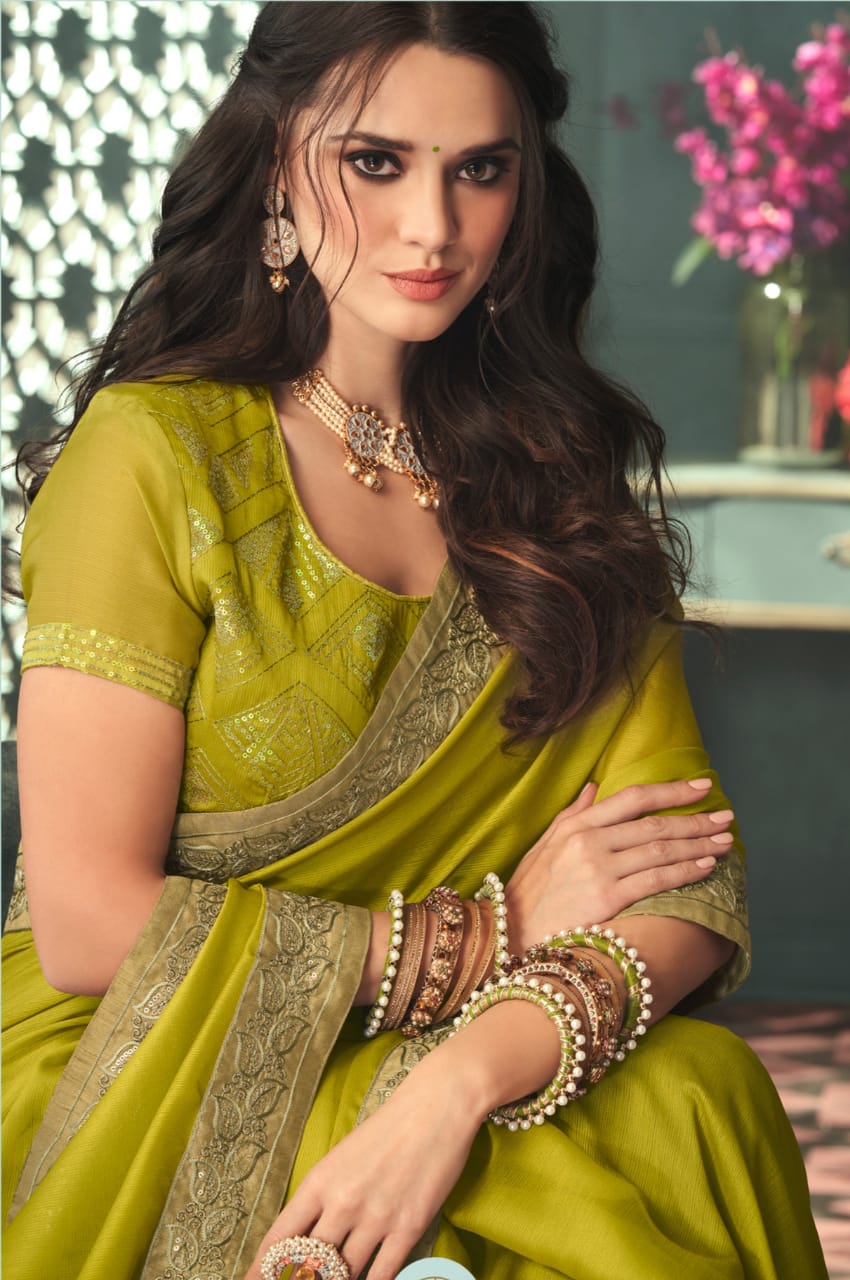 Parrot green party wear glitter chiffon saree is lightweighted with sequins work that you can wear for any occasion without any discomfort. It is suitable for both hand wash and  machine wash.