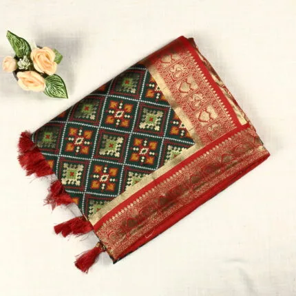 Beautiful patola silk saree comes with meenakari weaving patterns. Rich pallu with tassels and blouse available.It is suitable for both hand wash and machine wash.