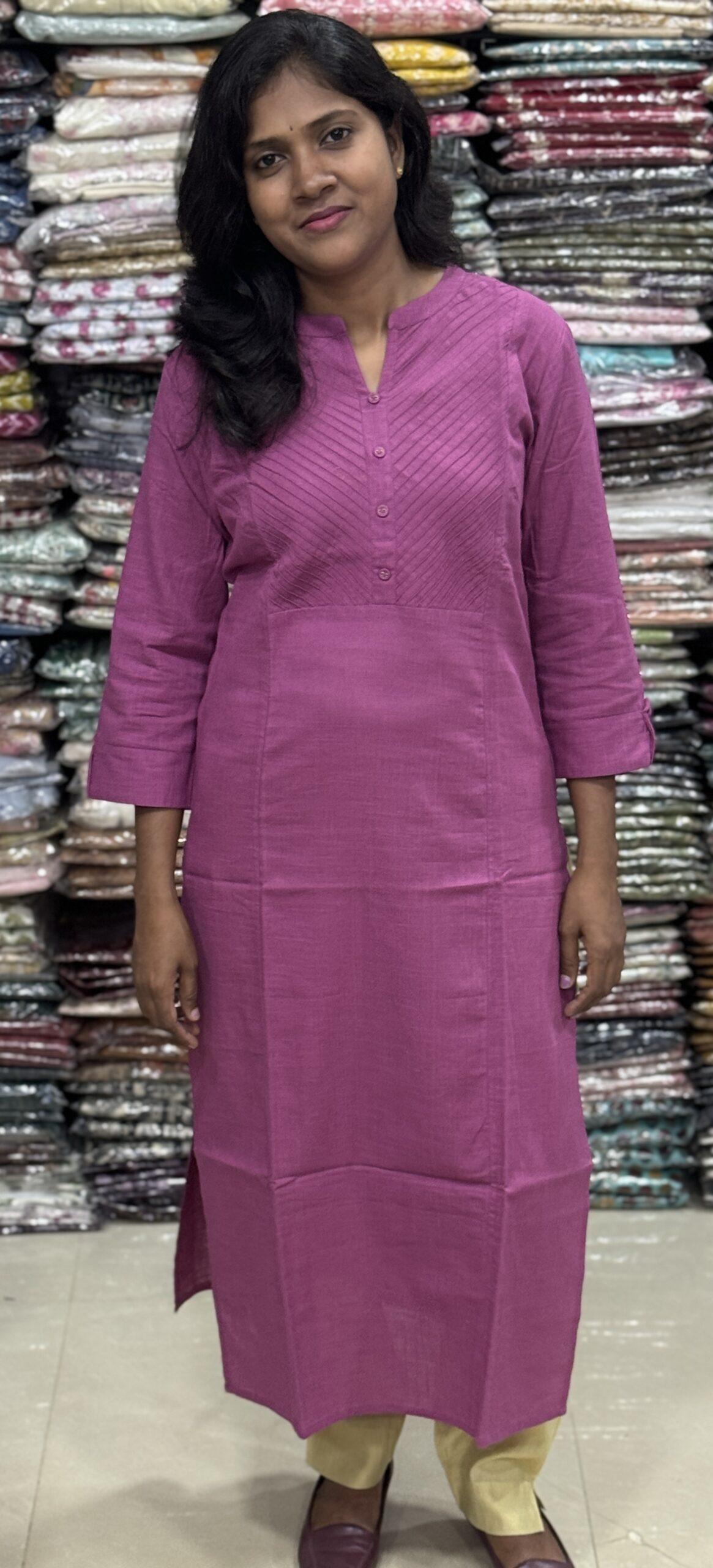 Beautiful cotton plain kurti with yoke patterns and decorative buttons. Perfect choice for casual wear. 