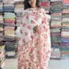 Floral printed soft cotton pleated long top has embroidery and sequins pattern in the yoke comes with elastic waist pant (embroidery in the border) and printed dupatta with laces.