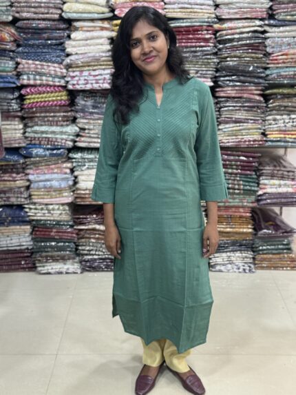 Beautiful cotton plain kurti with yoke patterns and decorative buttons. Perfect choice for casual wear. 