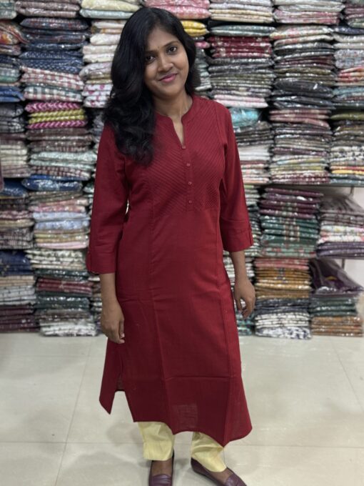 Beautiful cotton plain kurti crafted with yoke patterns and decorative buttons. Perfect choice for casual wear.