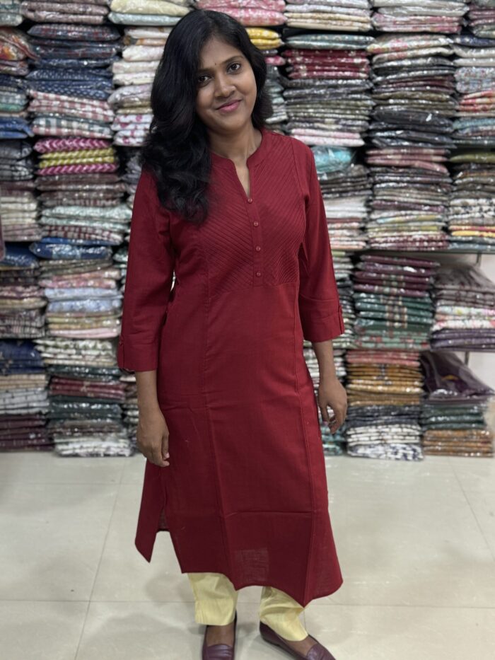 Beautiful cotton plain kurti crafted with yoke patterns and decorative buttons. Perfect choice for casual wear.