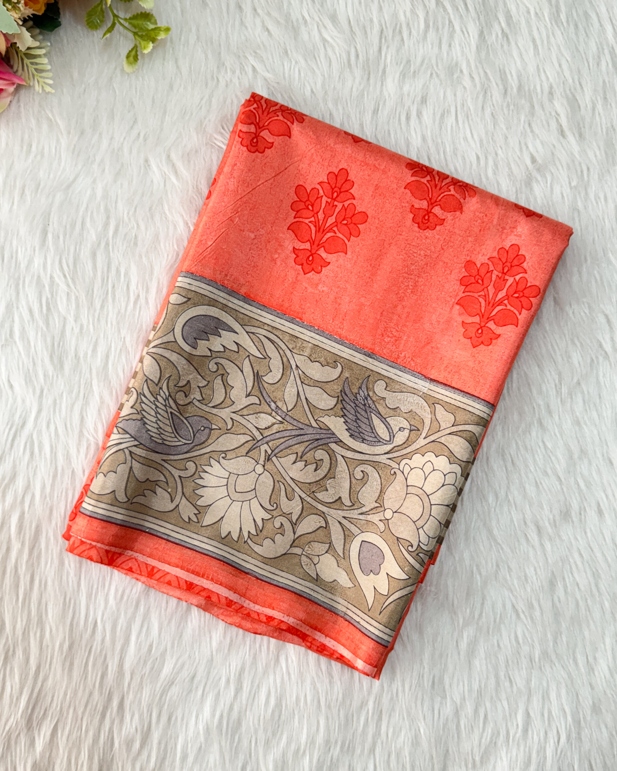 Beautiful crepe silk saree with floral designs with contrast  border and blouse.