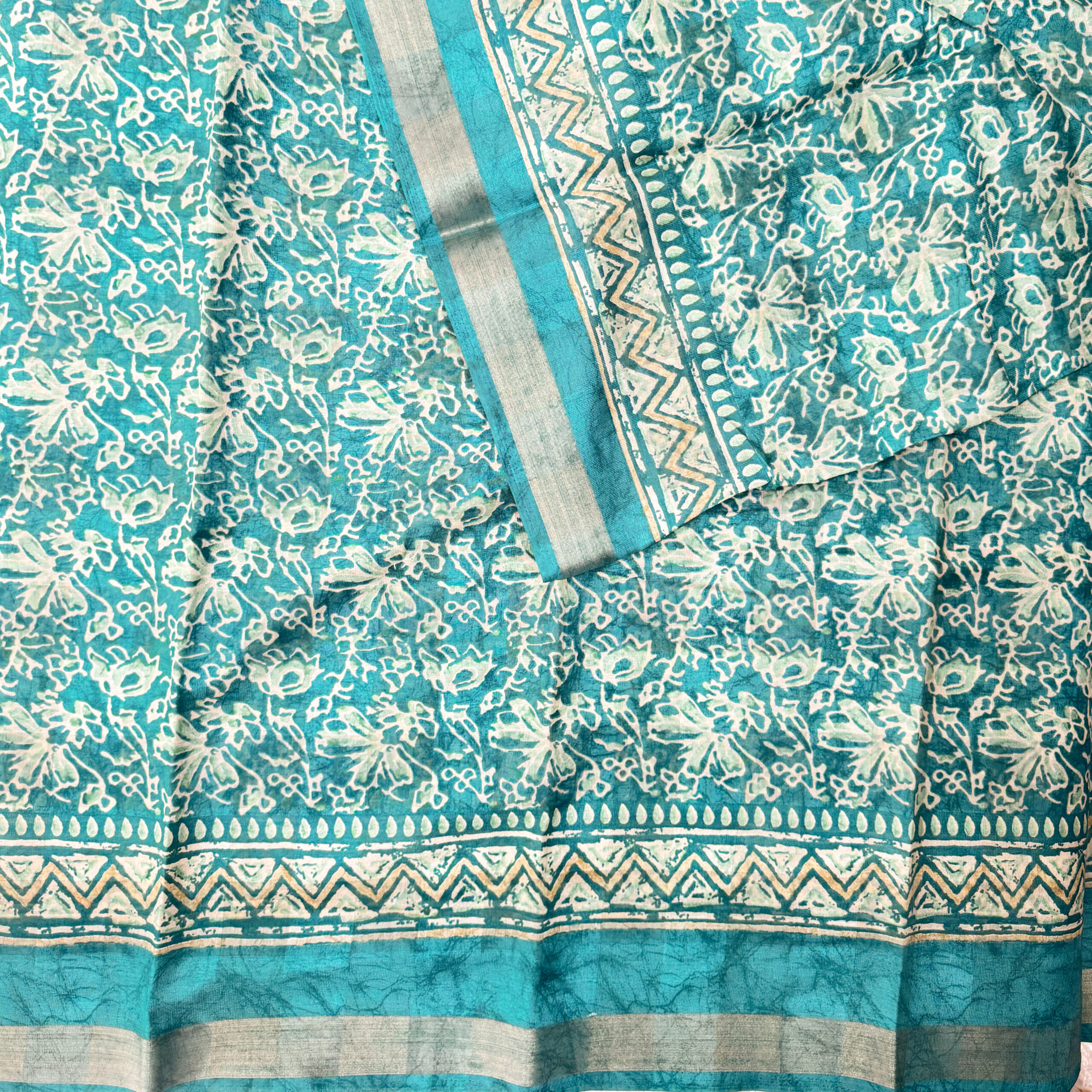 Beautiful cotton saree with floral designs with small zari border and  running blouse.