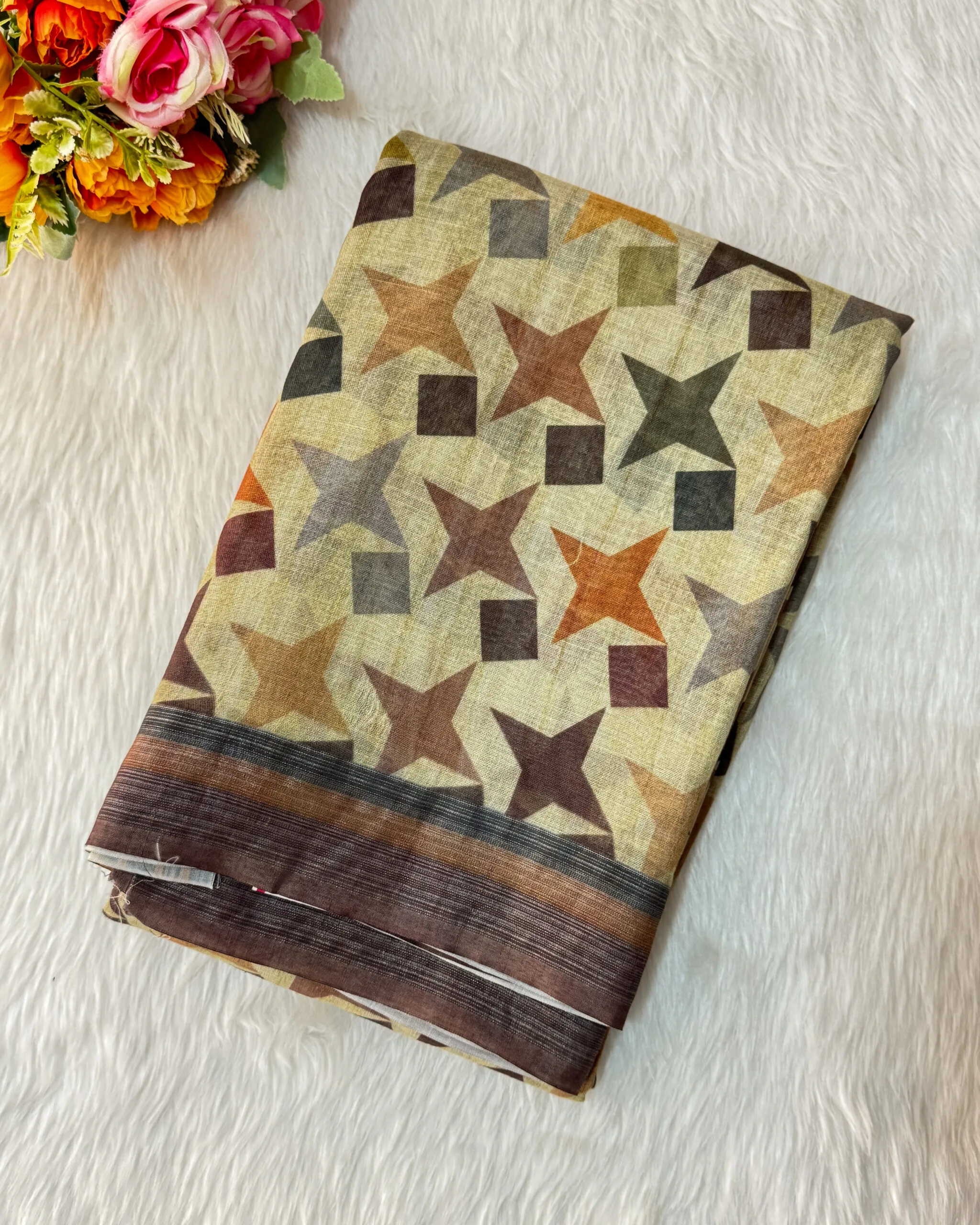 A beautiful printed saree has a star designs comes with contrast  blouse