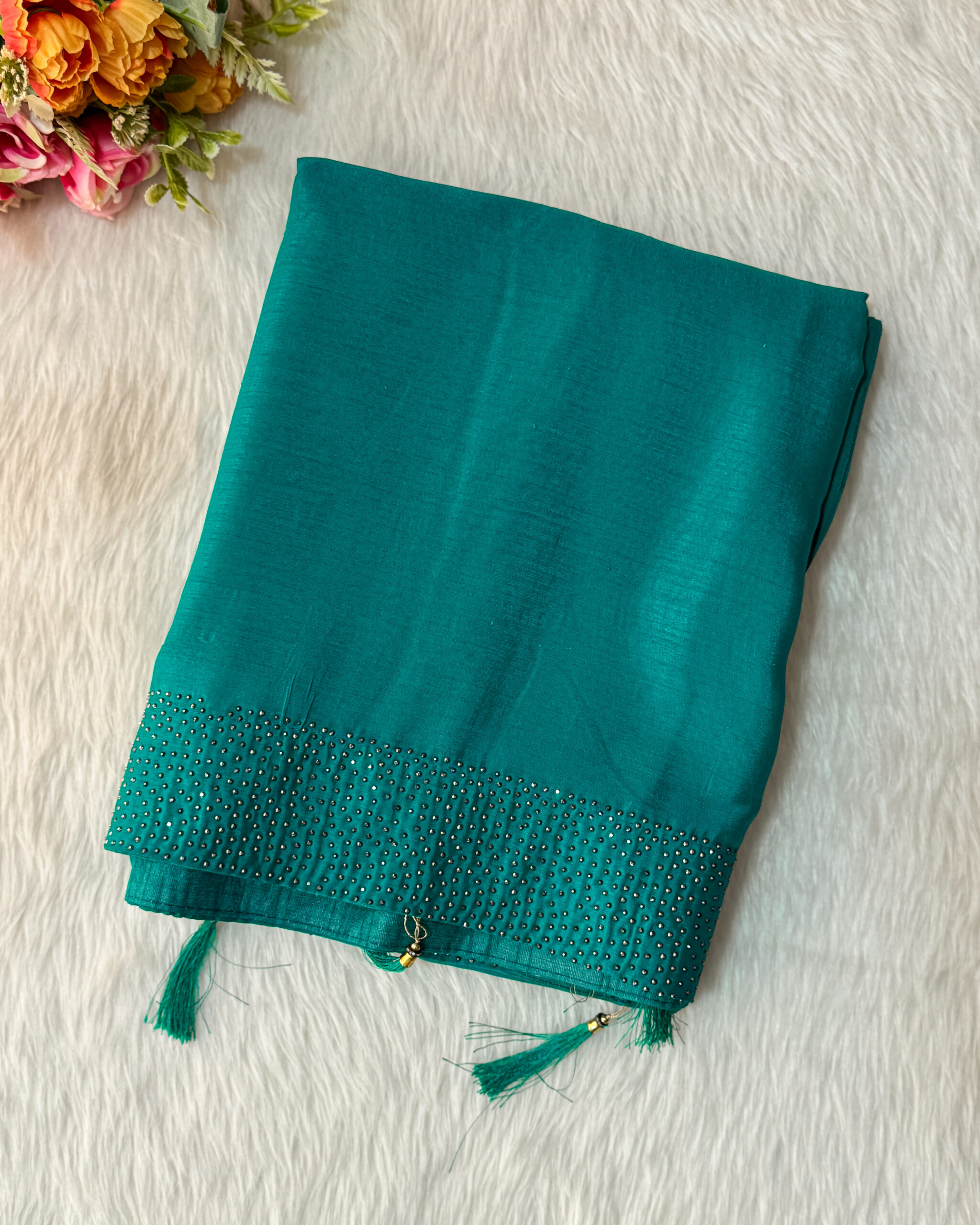A beautiful printed saree has a banarasi border comes with blouse and pallu with tassels.