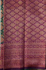 Beautiful silk saree with floral zari weaves and stones comes with contrast border, blouse and pallu.