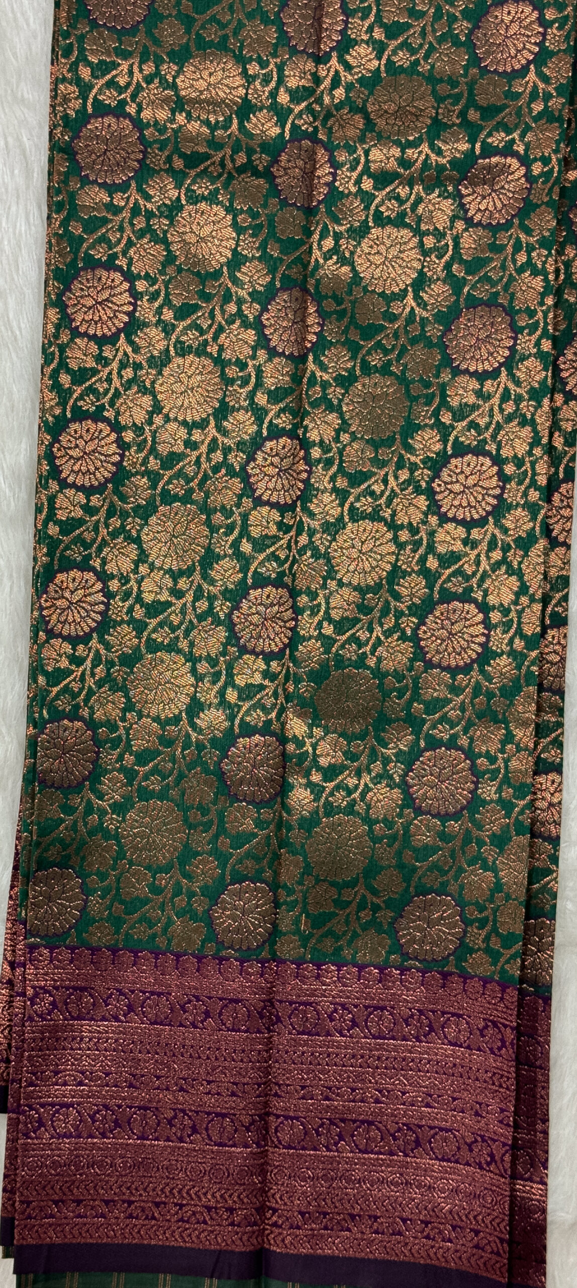 Beautiful silk saree with floral zari weaves and stones comes with contrast border, blouse and pallu.