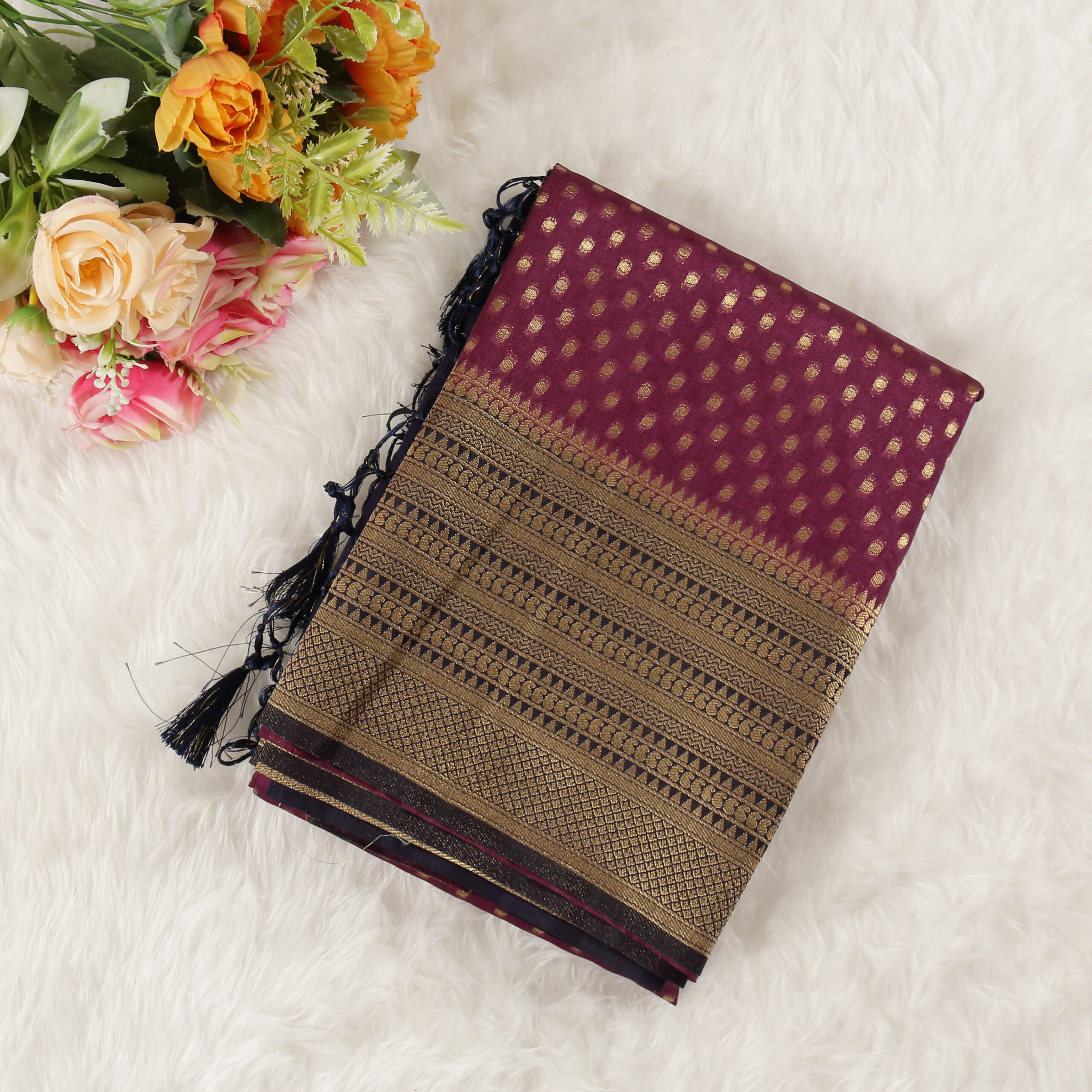 The Beautiful Banarasi Silk Saree with allover zari woven butta. Contrast zari woven border and pallu comes with running blouse.